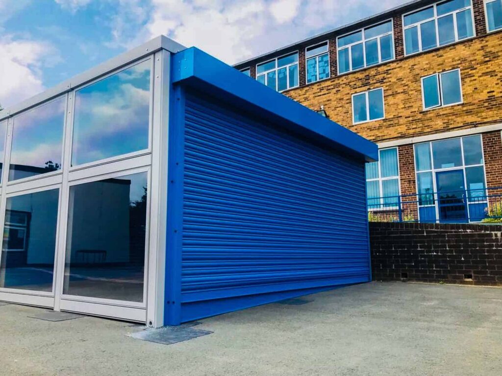Blue roller shutter outside building