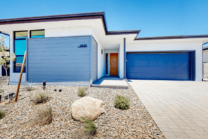 Blue roller shutters on isolated property